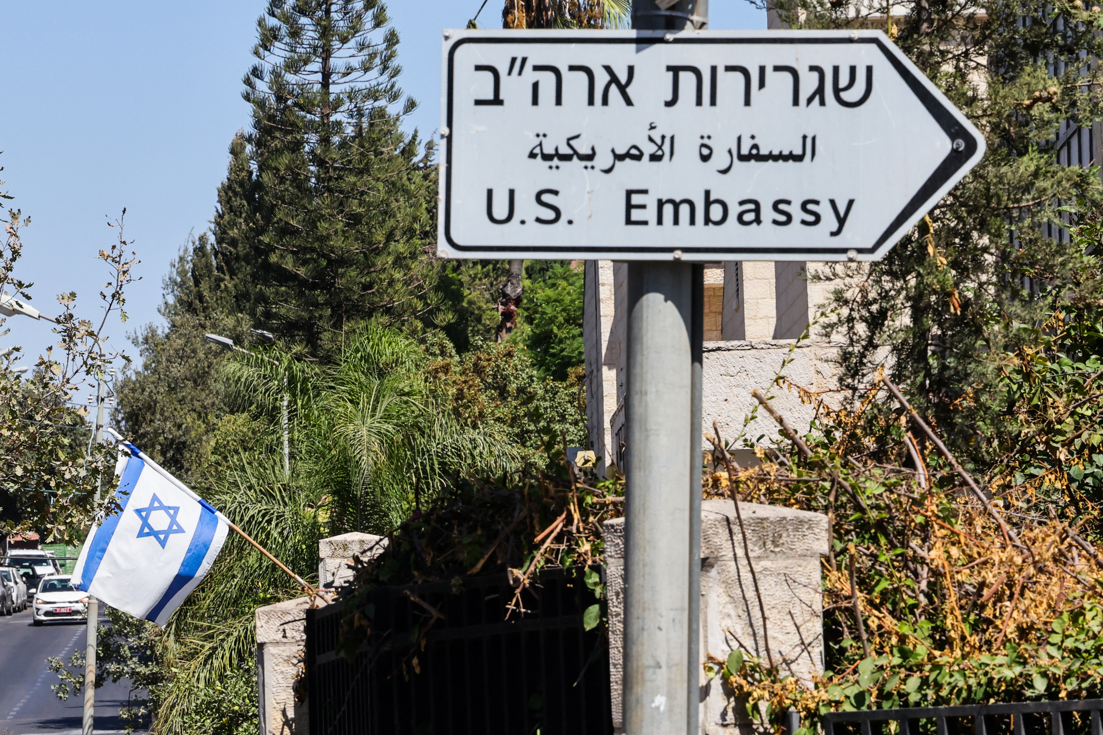 Israeli flag and sign for the U.S. Embassy in Jerusalem.