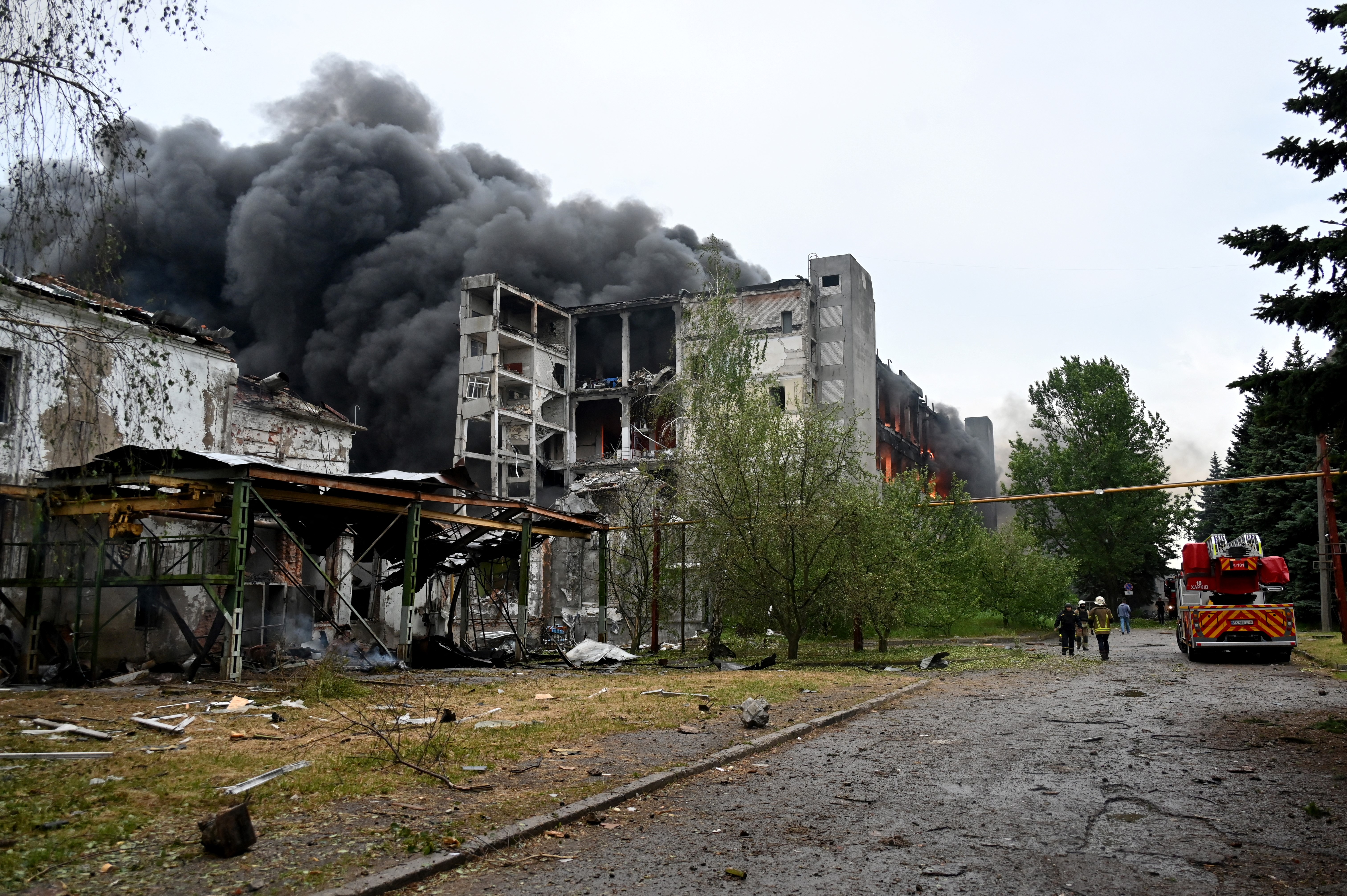Firefighters battling a large fire at a damaged building in Kharkiv, Ukraine.