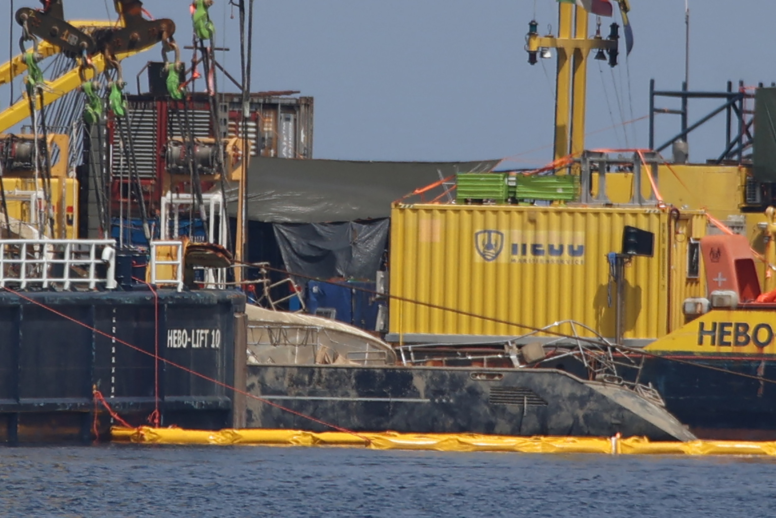 Crane ships raising the sunken superyacht Bayesian.