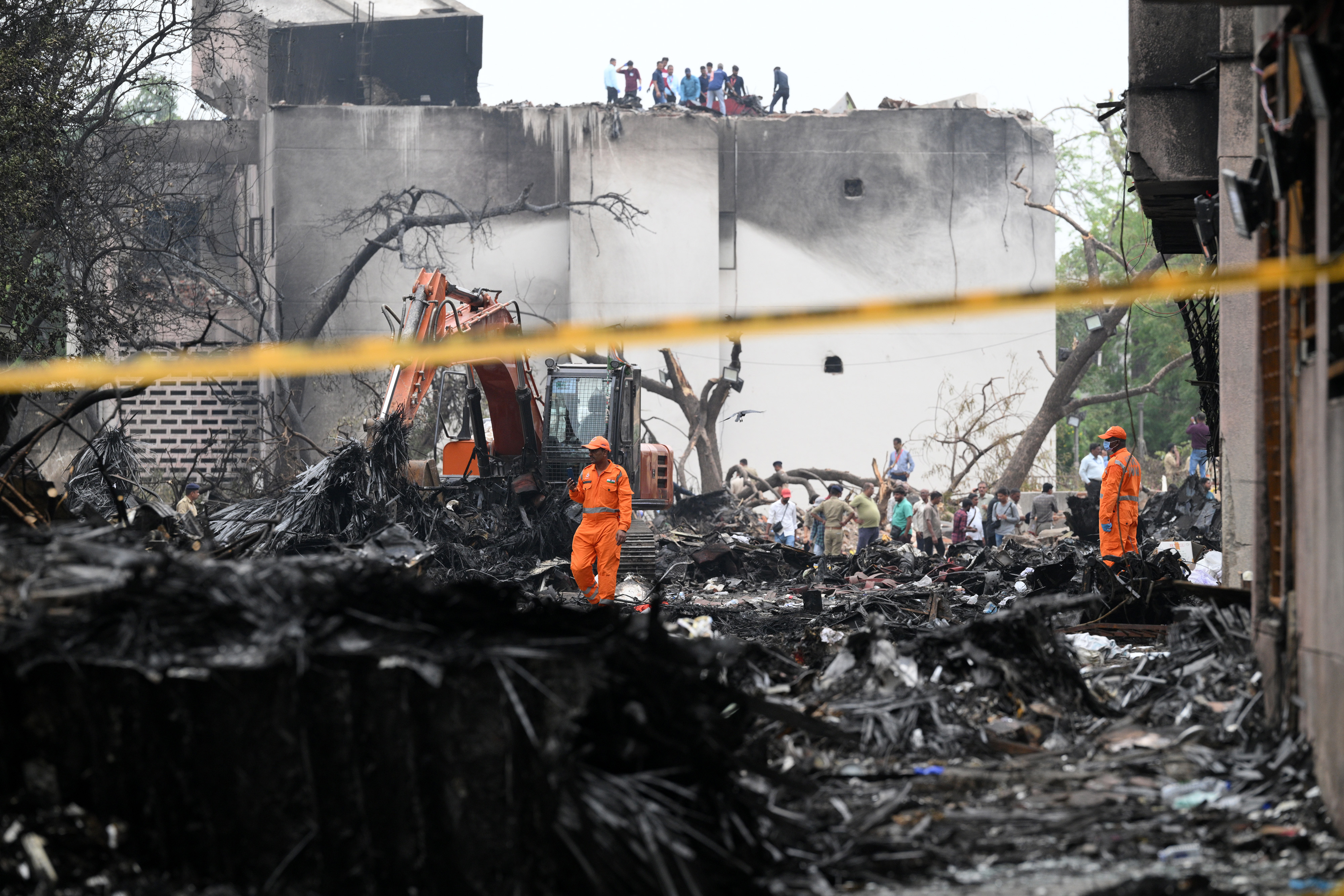 SDRF personnel surveying the site of a plane crash.