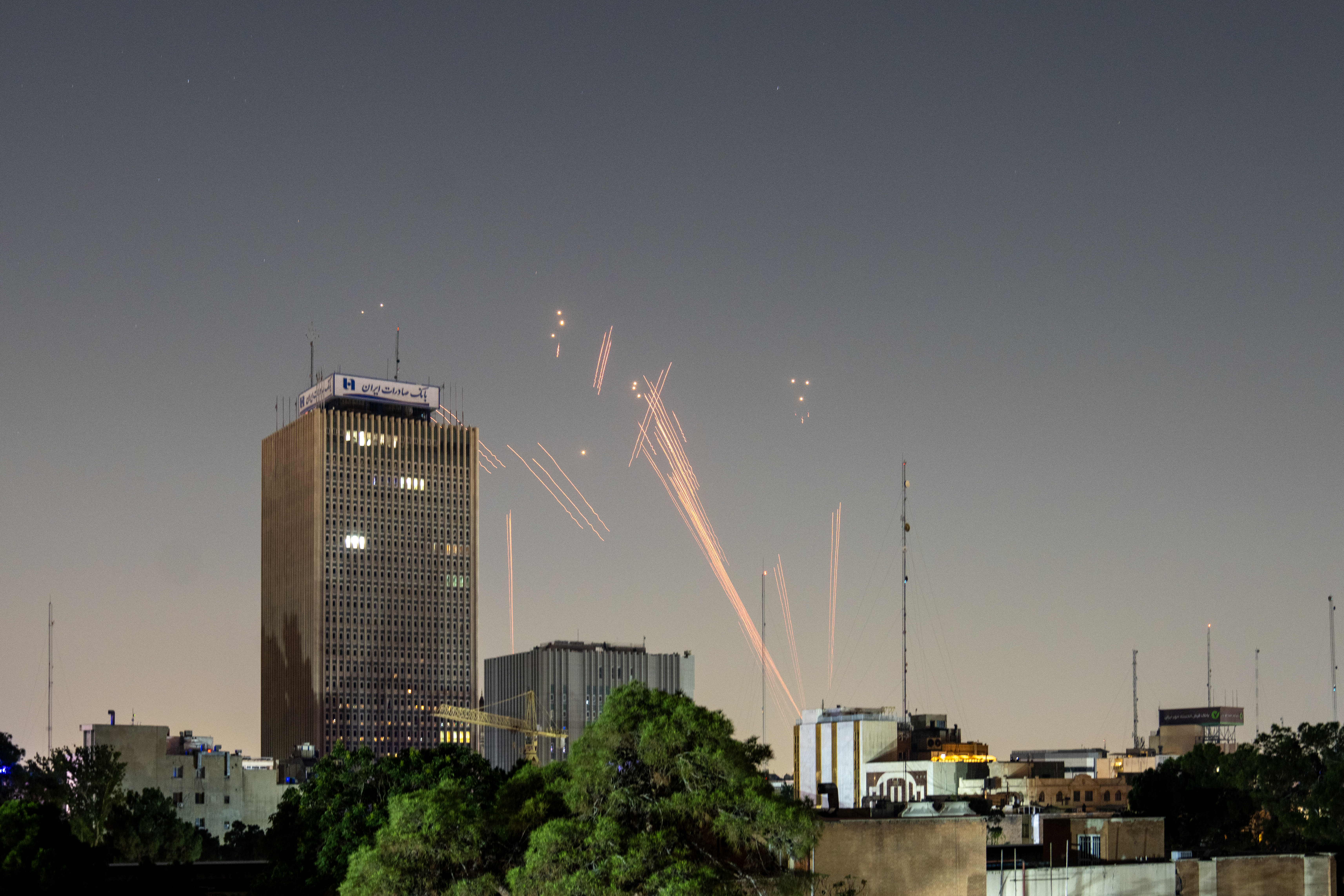 Projectile trails in the night sky over Tehran, Iran.