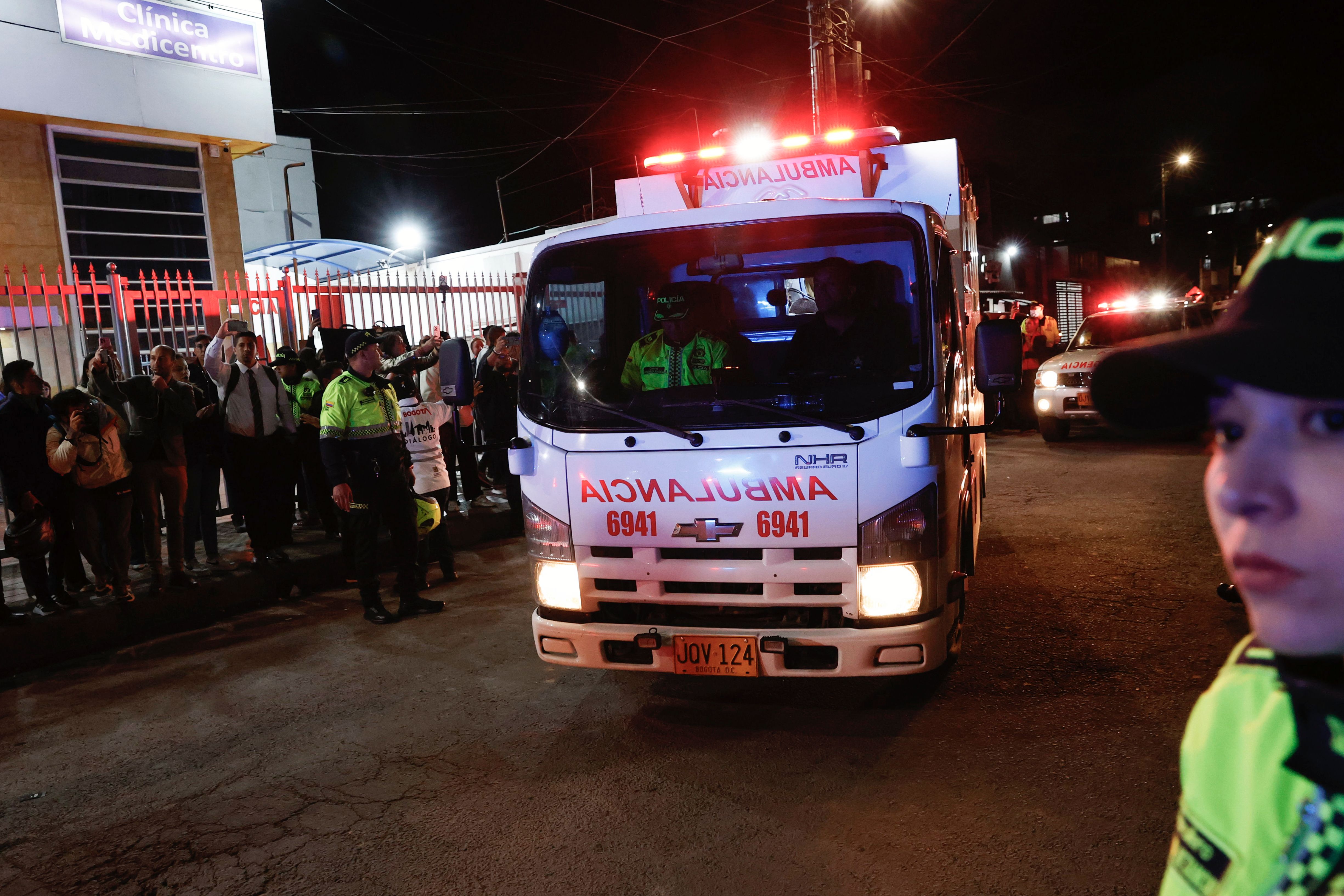 An ambulance carrying Uribe drives through the streets of Bogota to a hospital to treat the politician.