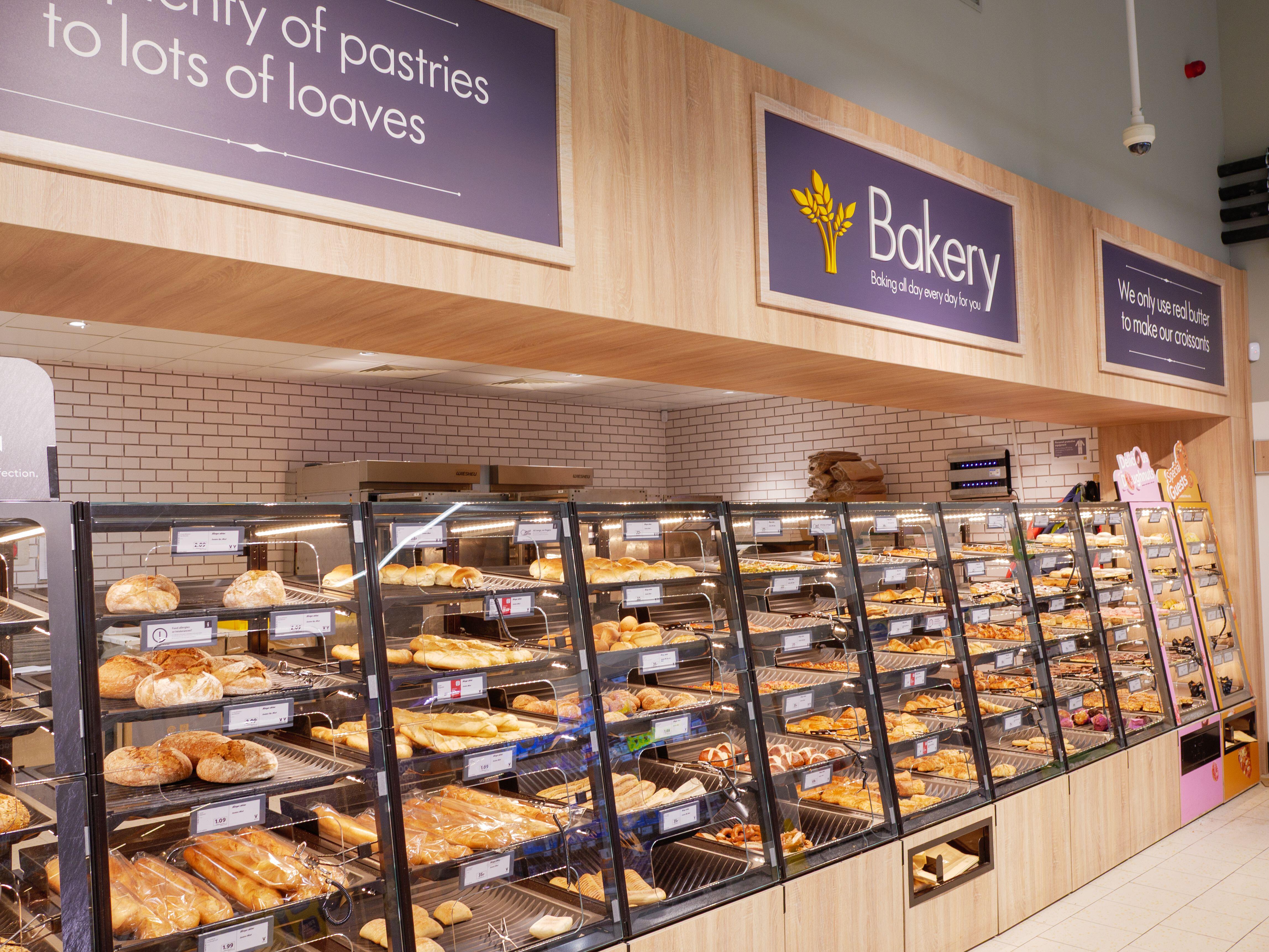 Lidl bakery section with various breads and pastries on display.