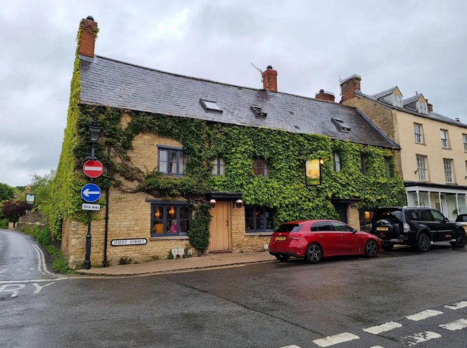 The Bull pub in Charlbury, covered in ivy.
