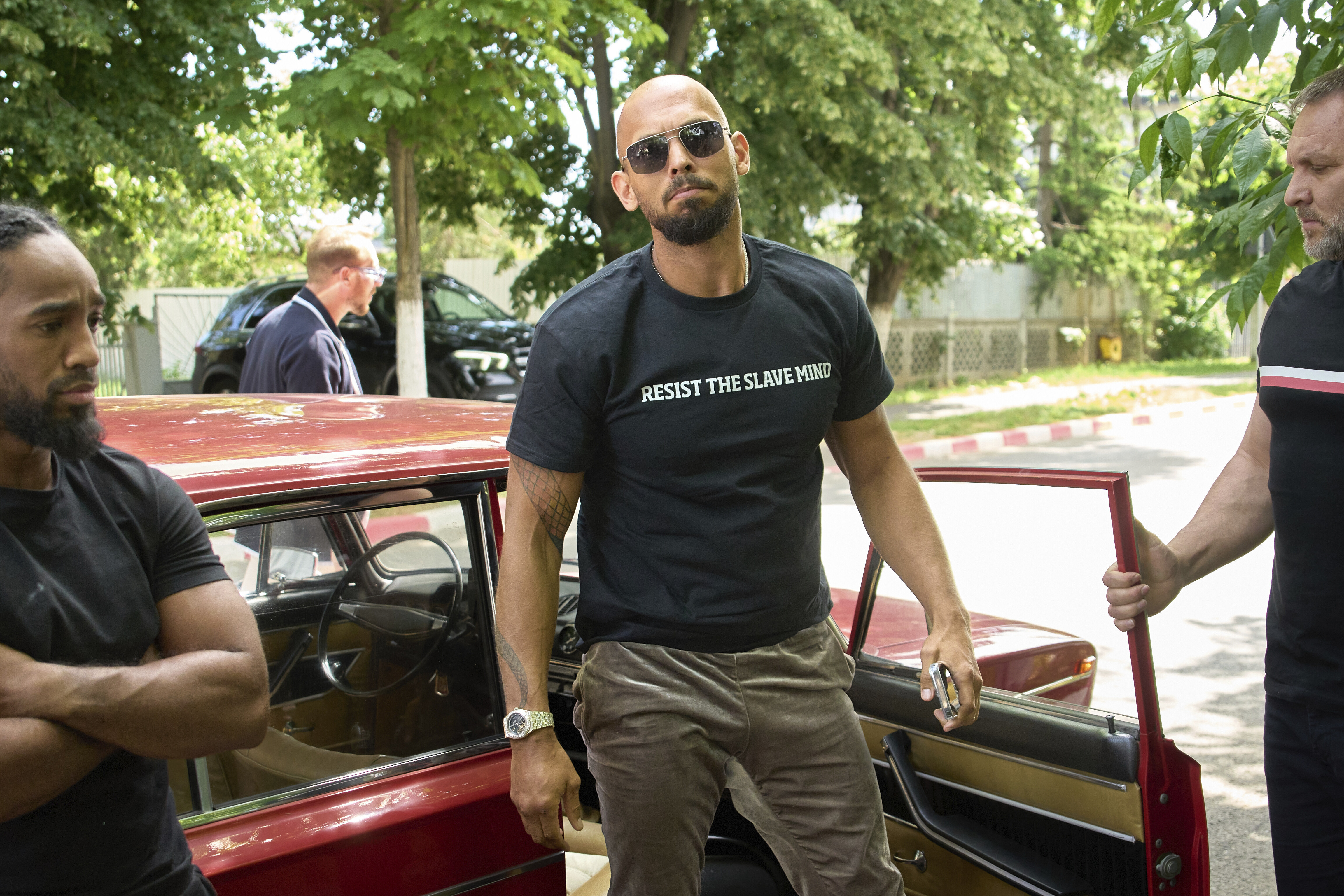 Andrew Tate arrives at a police station in Voluntari, Romania, on May 21, 2025.