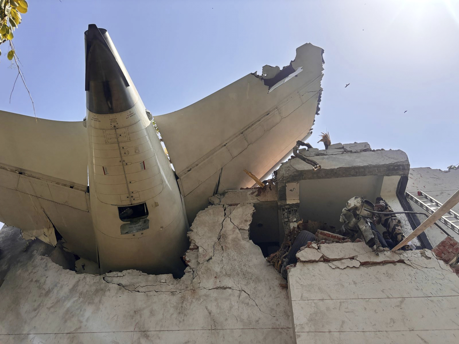 Debris of a plane crashed into a building.