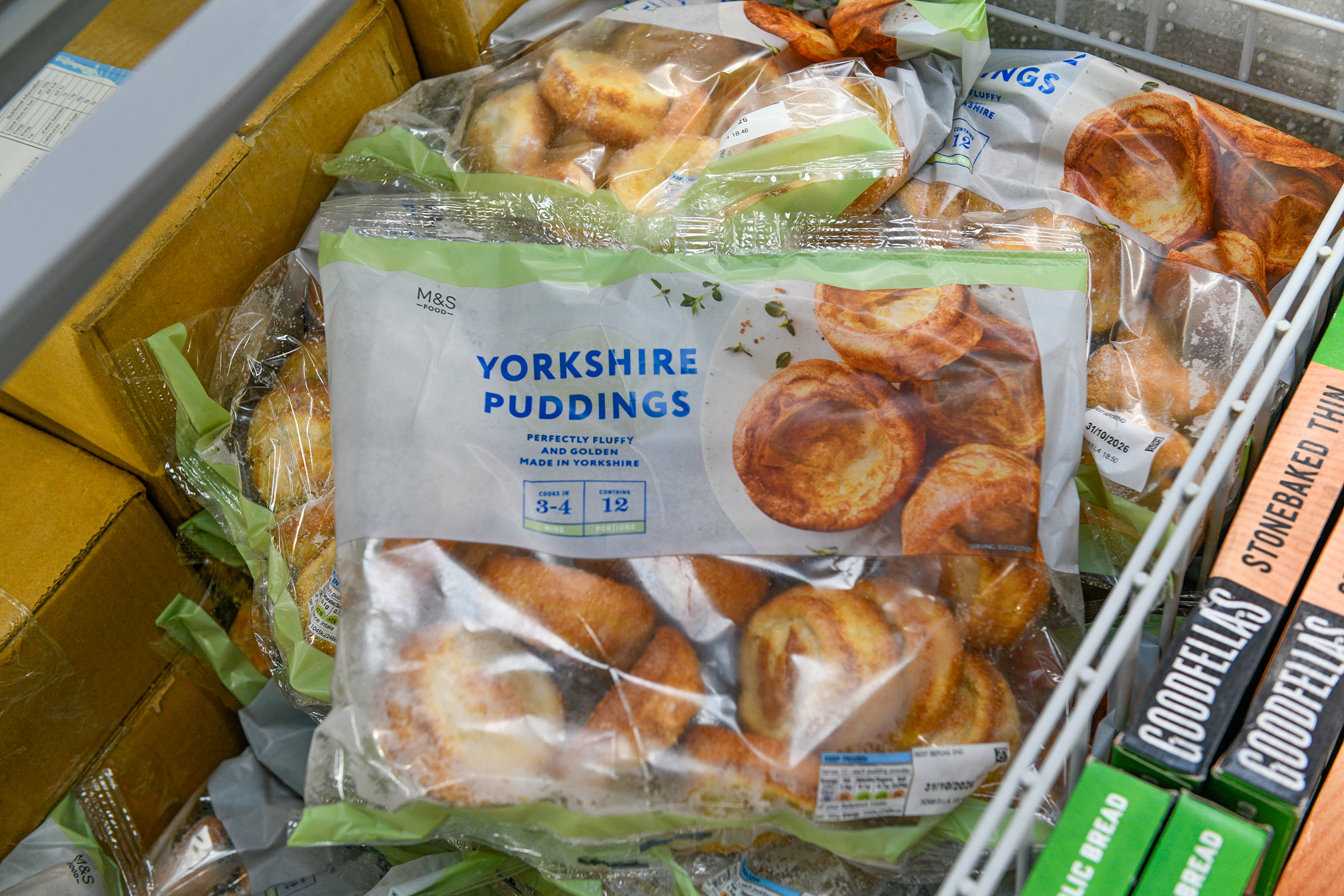 Bag of frozen M&S Yorkshire puddings in a freezer.