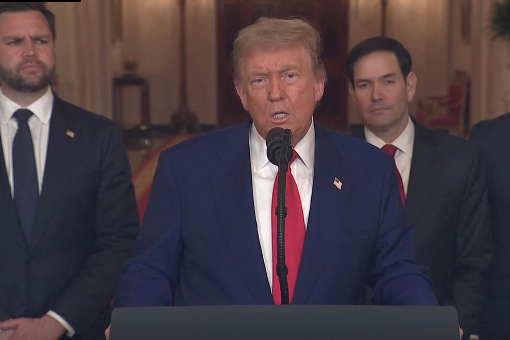 trump speaks to the nation; vance is behind him to the left, rubio and hegseth to the right