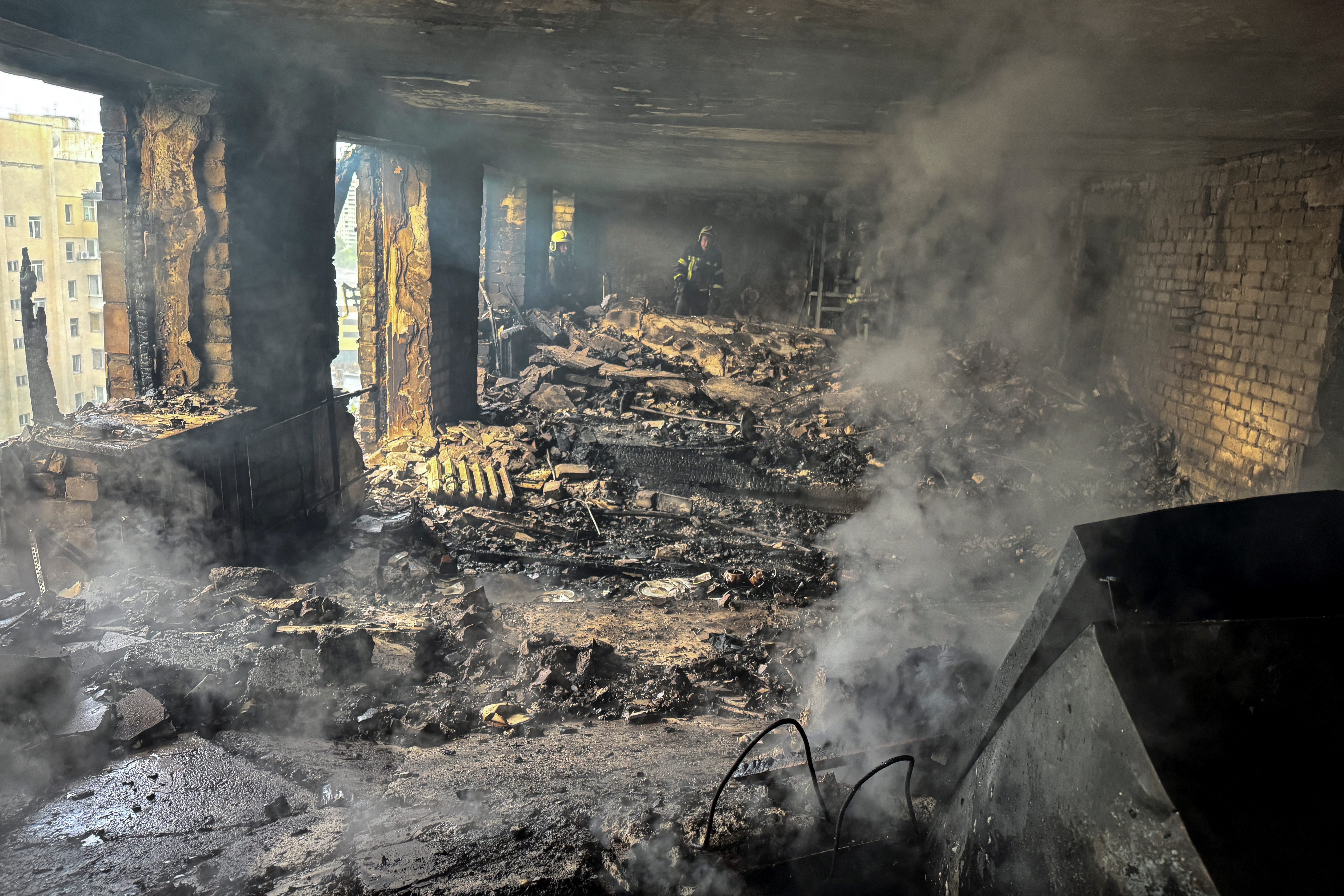 Aftermath of a drone attack in a Kharkiv apartment building.