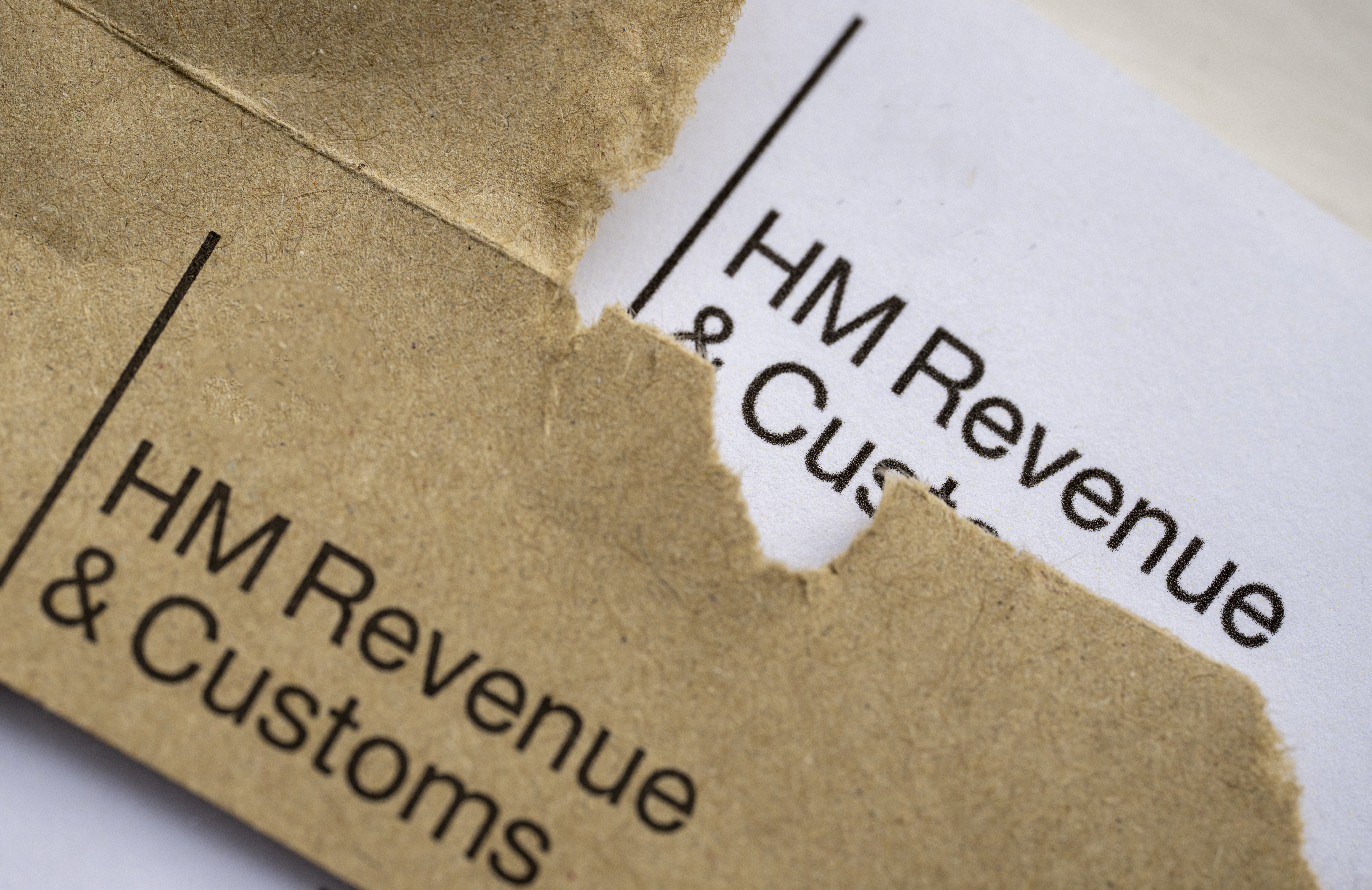 Close-up of a partially opened tax letter from HM Revenue & Customs.