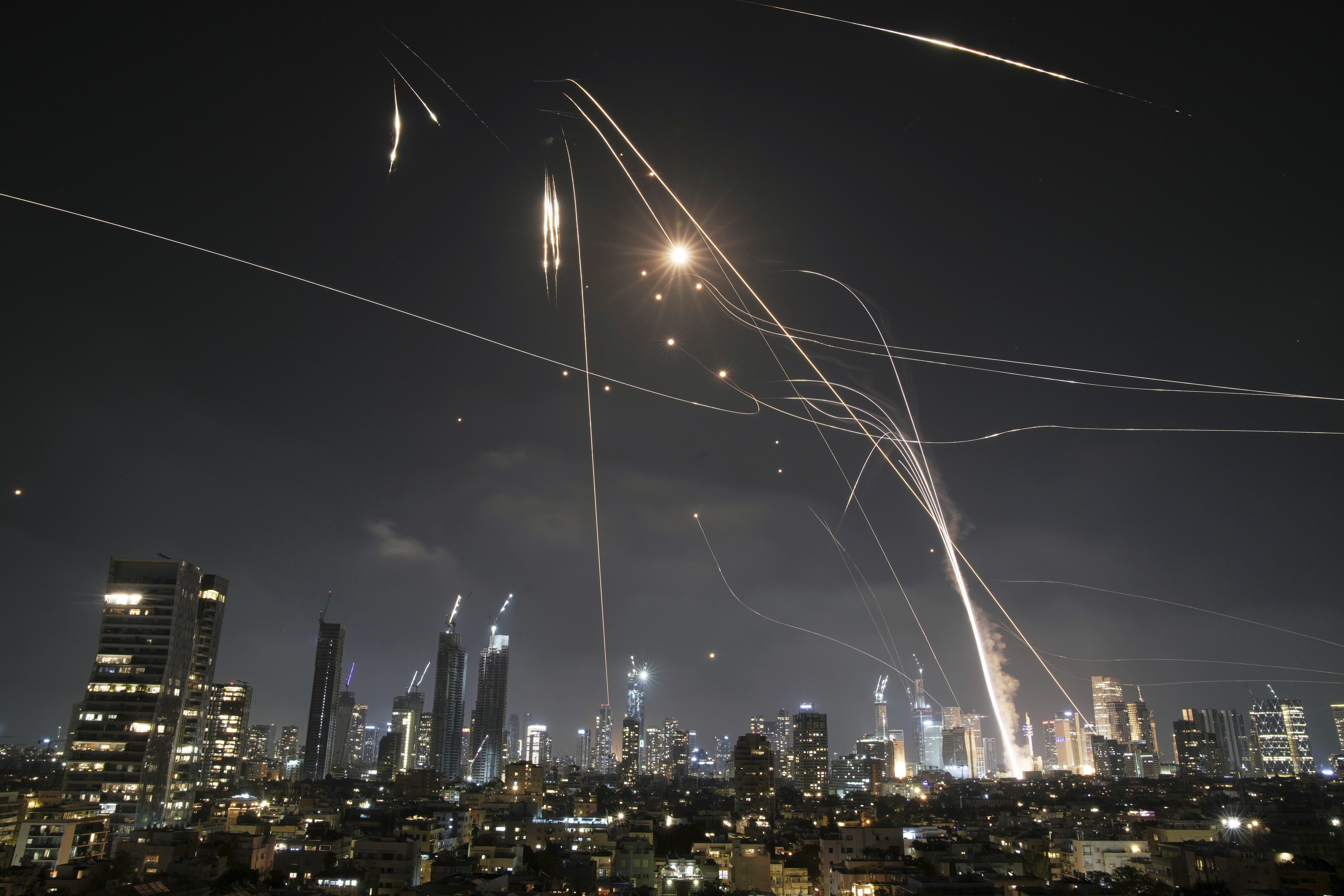 Iron Dome intercepts missiles over Tel Aviv at night.