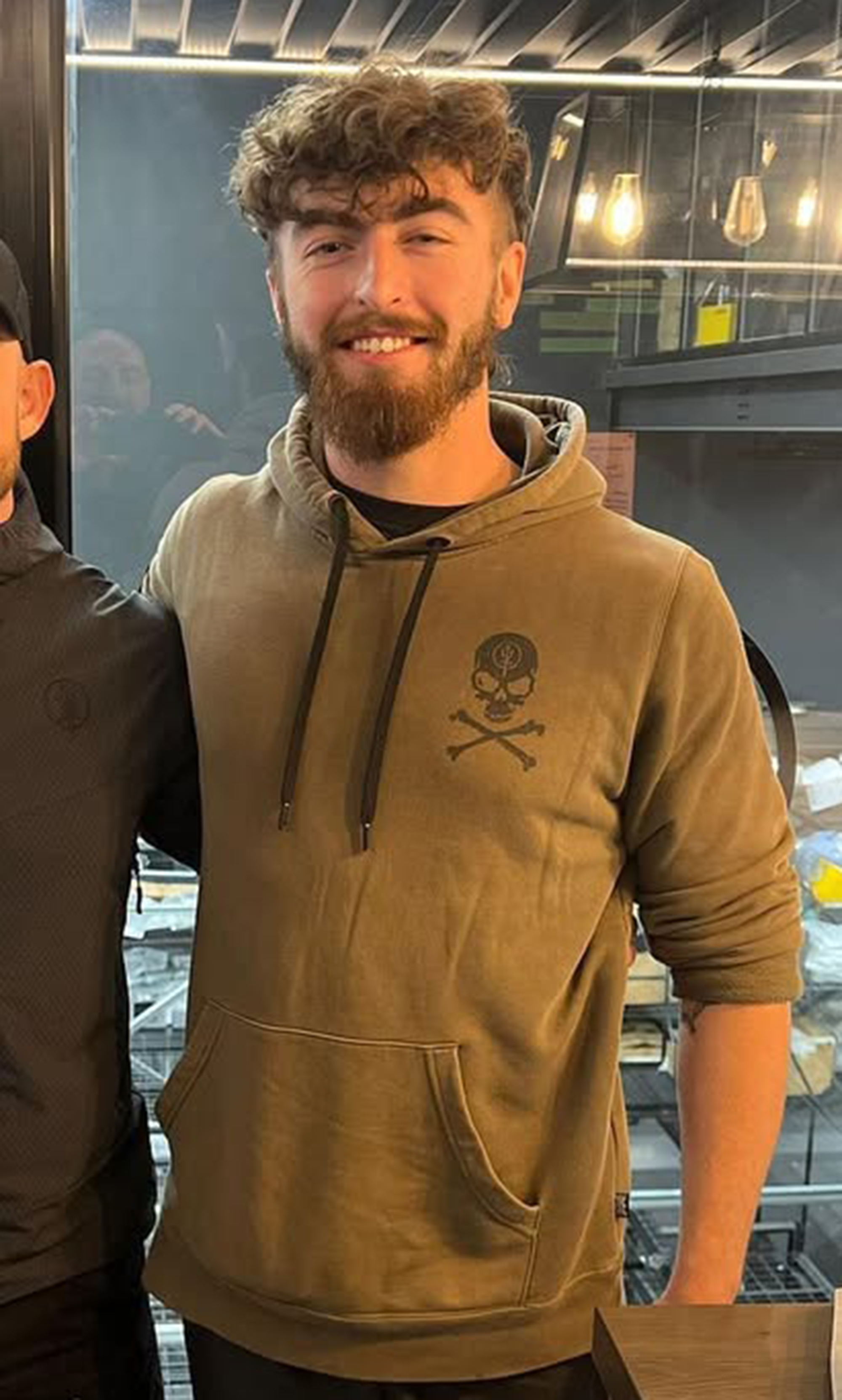 Photo of Liam Byrne wearing a brown hoodie.