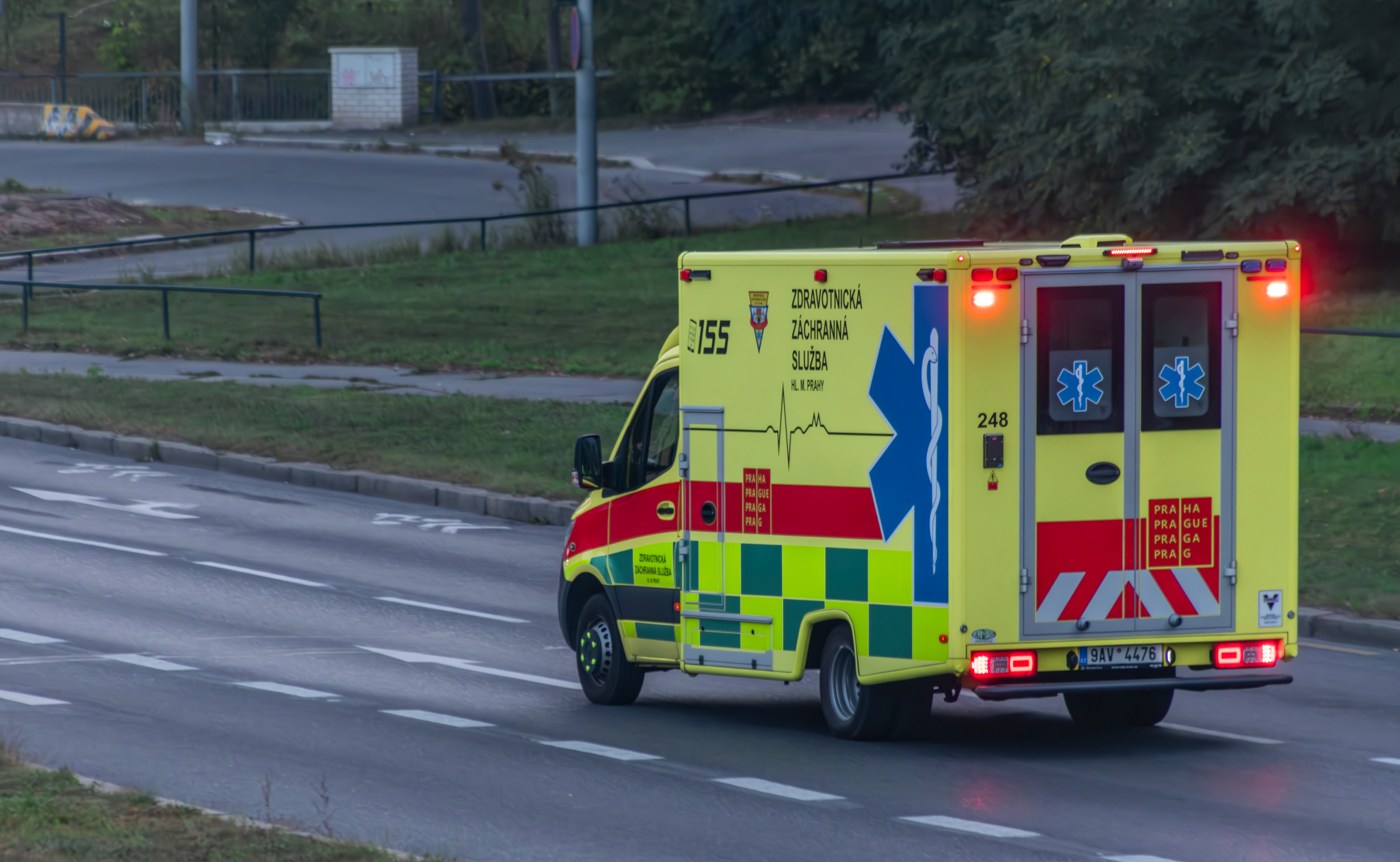 Ambulance driving on a city street in Prague.