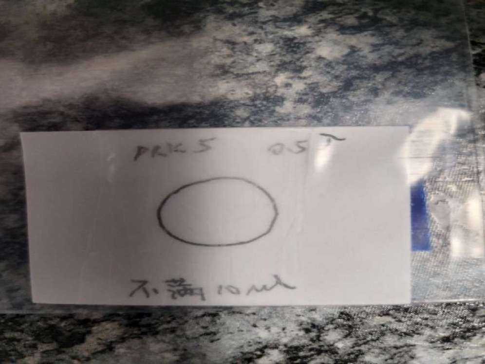 Handwritten label on a seized package indicating 