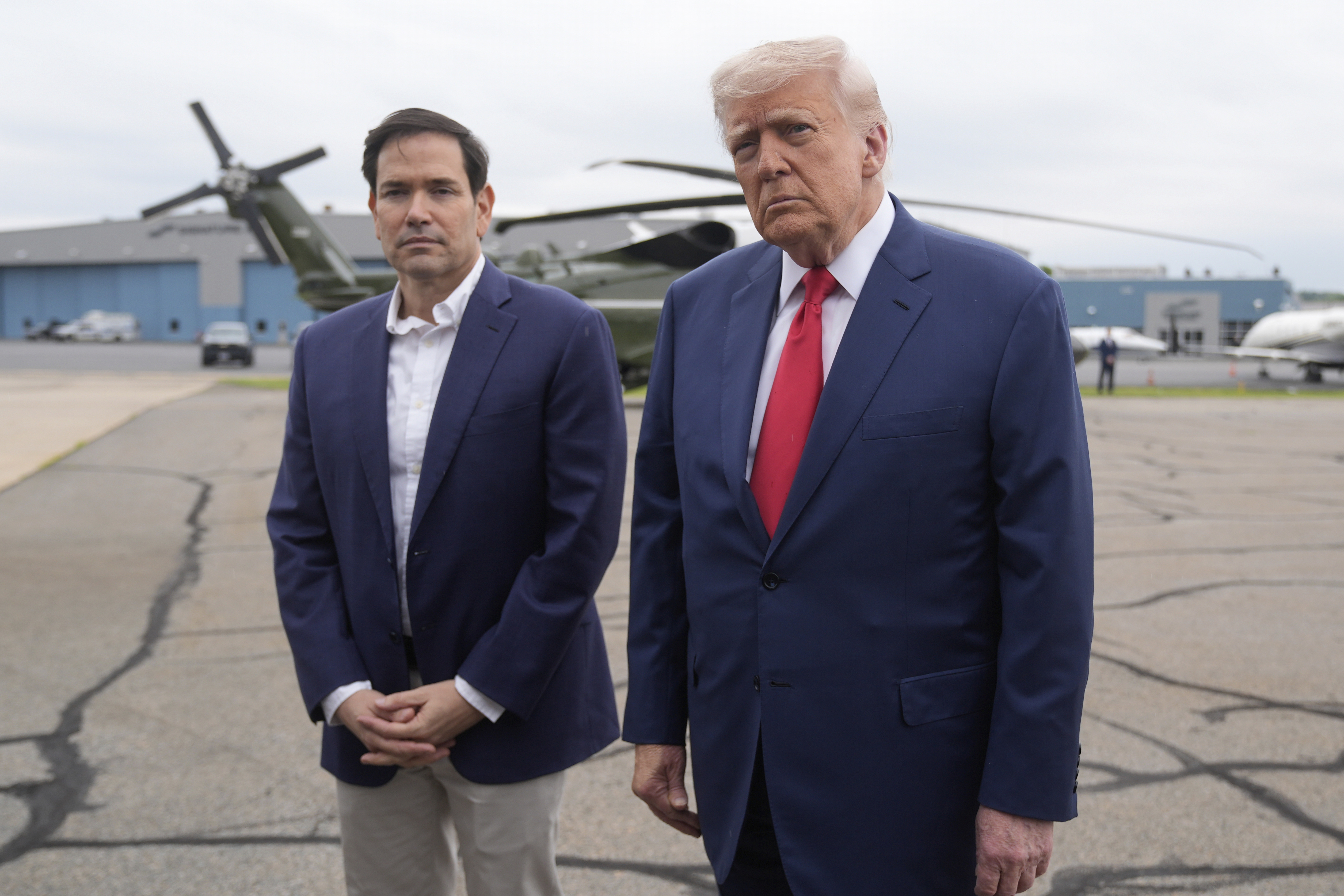 President Donald Trump and Secretary of State Marco Rubio speak with reporters at Morristown Municipal Airport in Morristown, NJ on June 8, 2025.