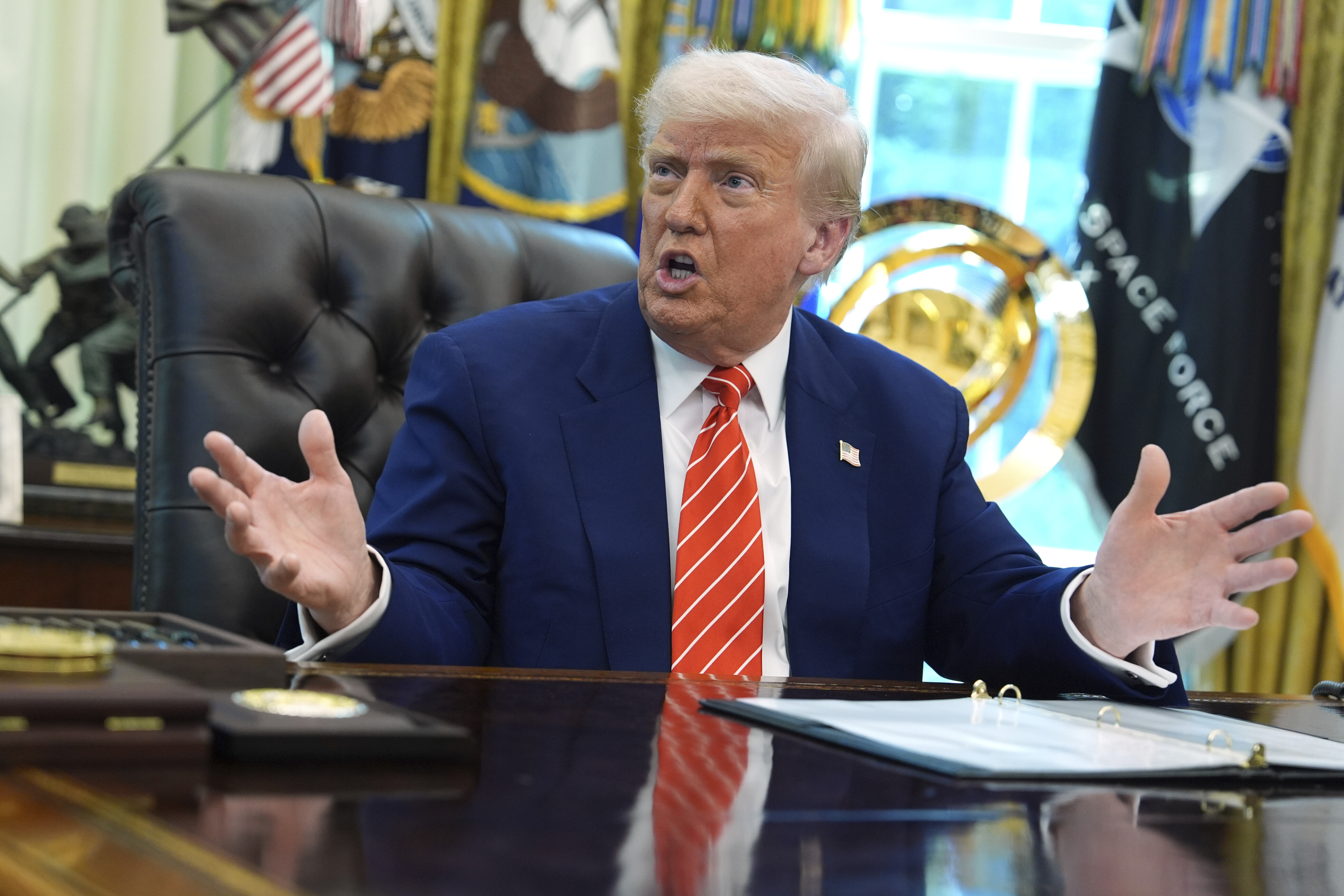 Donald Trump speaking at a news conference.