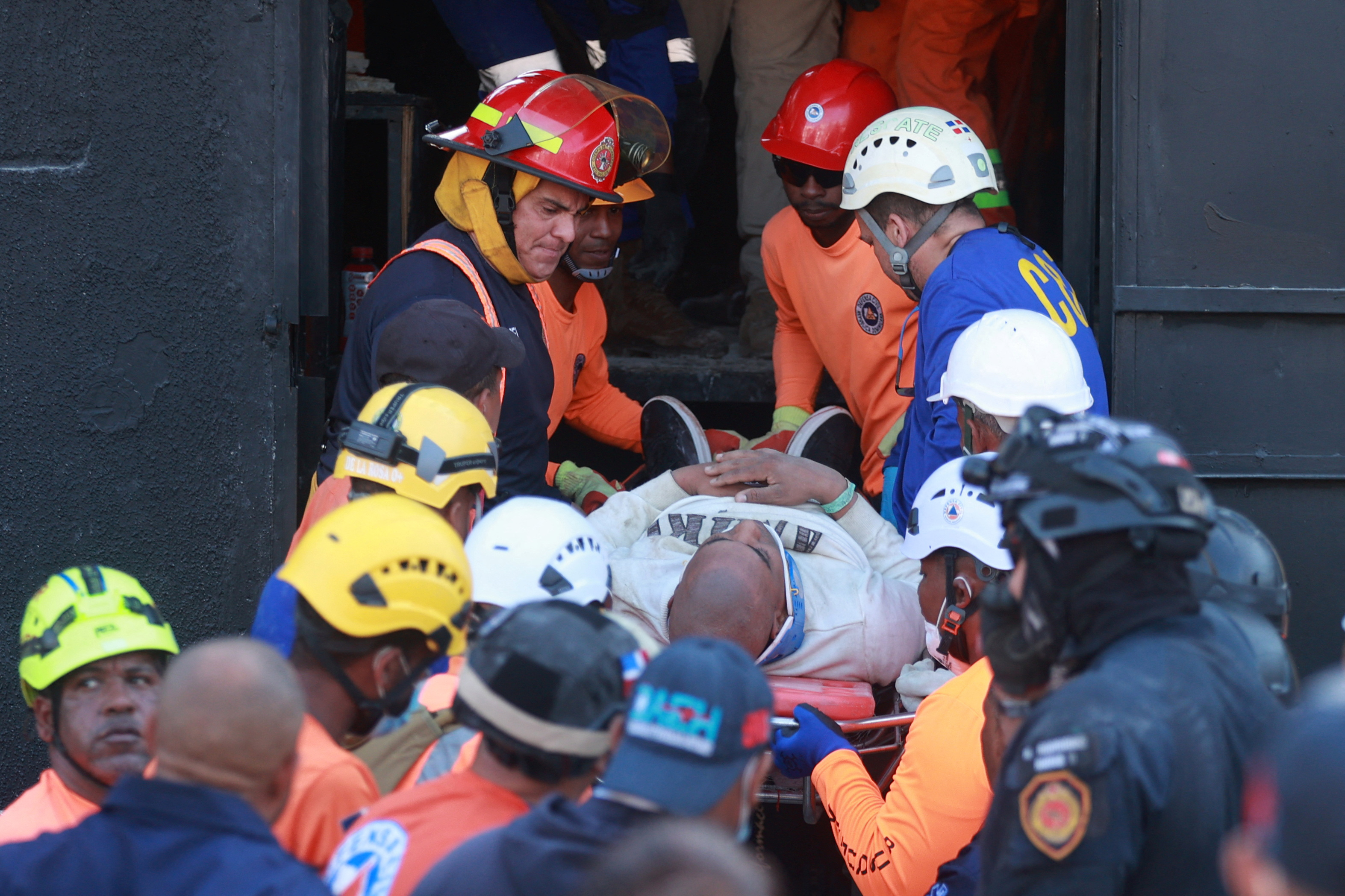 Rescue workers removing an injured person from a collapsed nightclub in Santo Domingo.