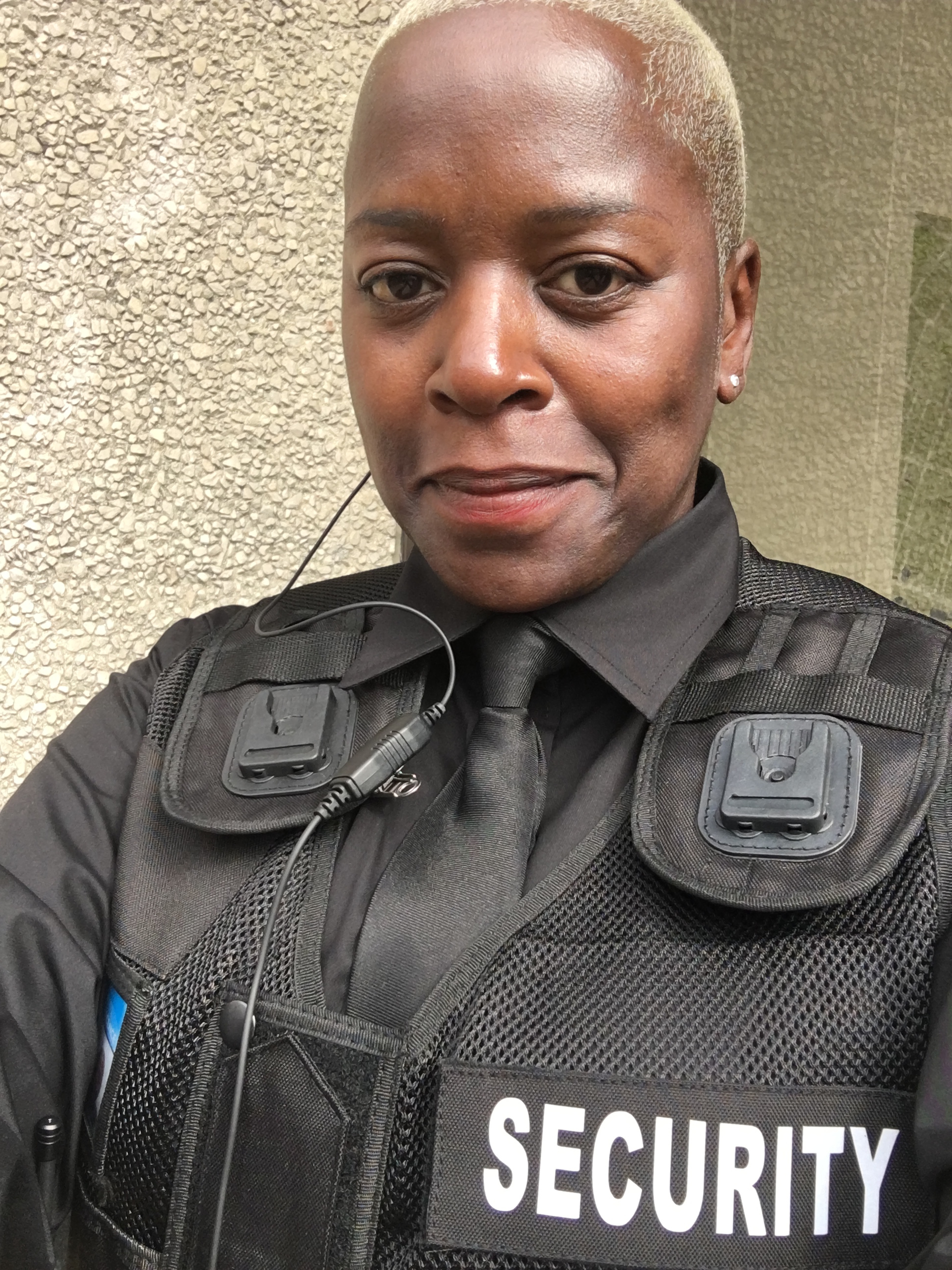 Lisa Baskott, Founder and CEO of 2nd Line of Defence Ltd, in a security uniform.