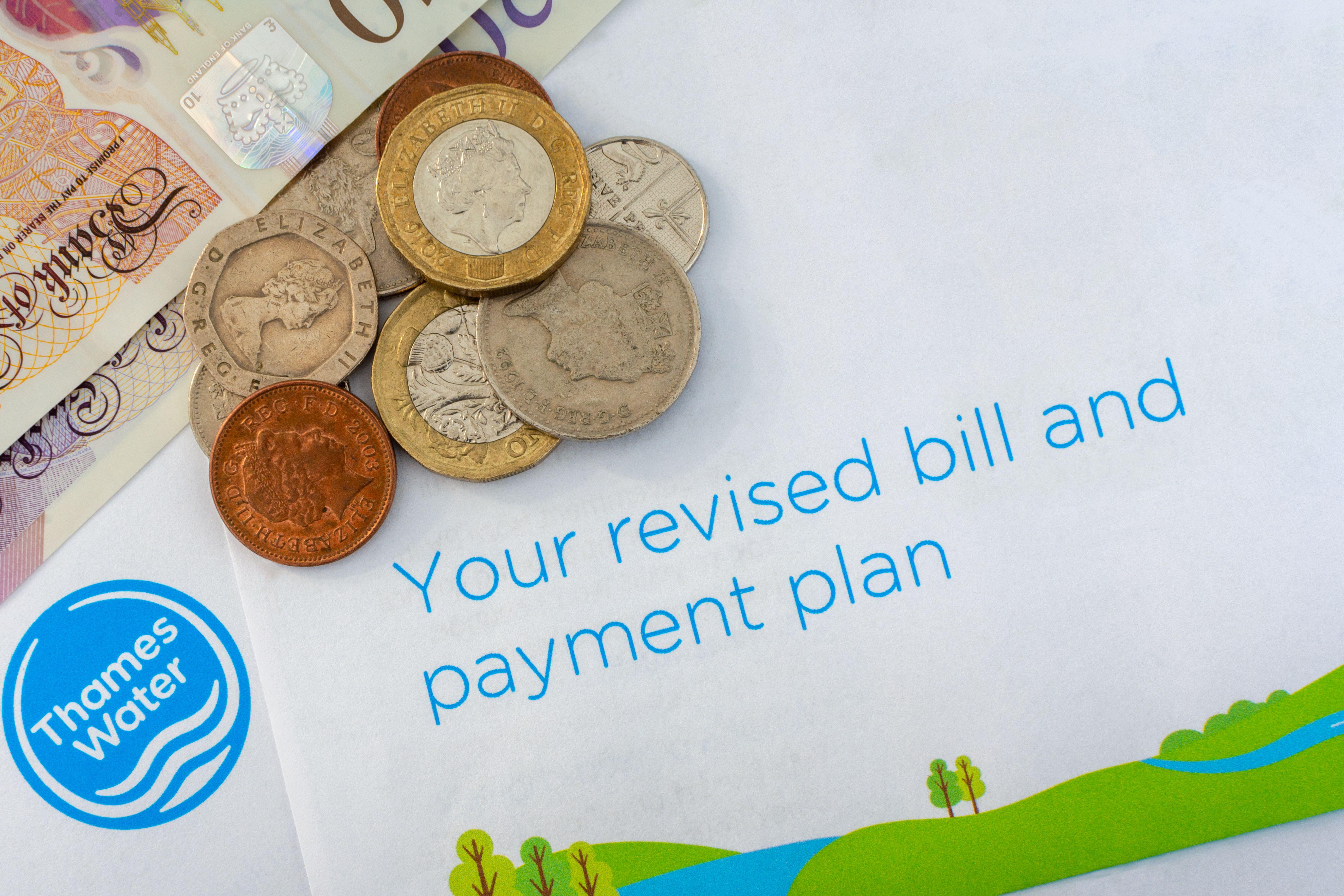 Thames Water bill with UK currency; cost of living concept.