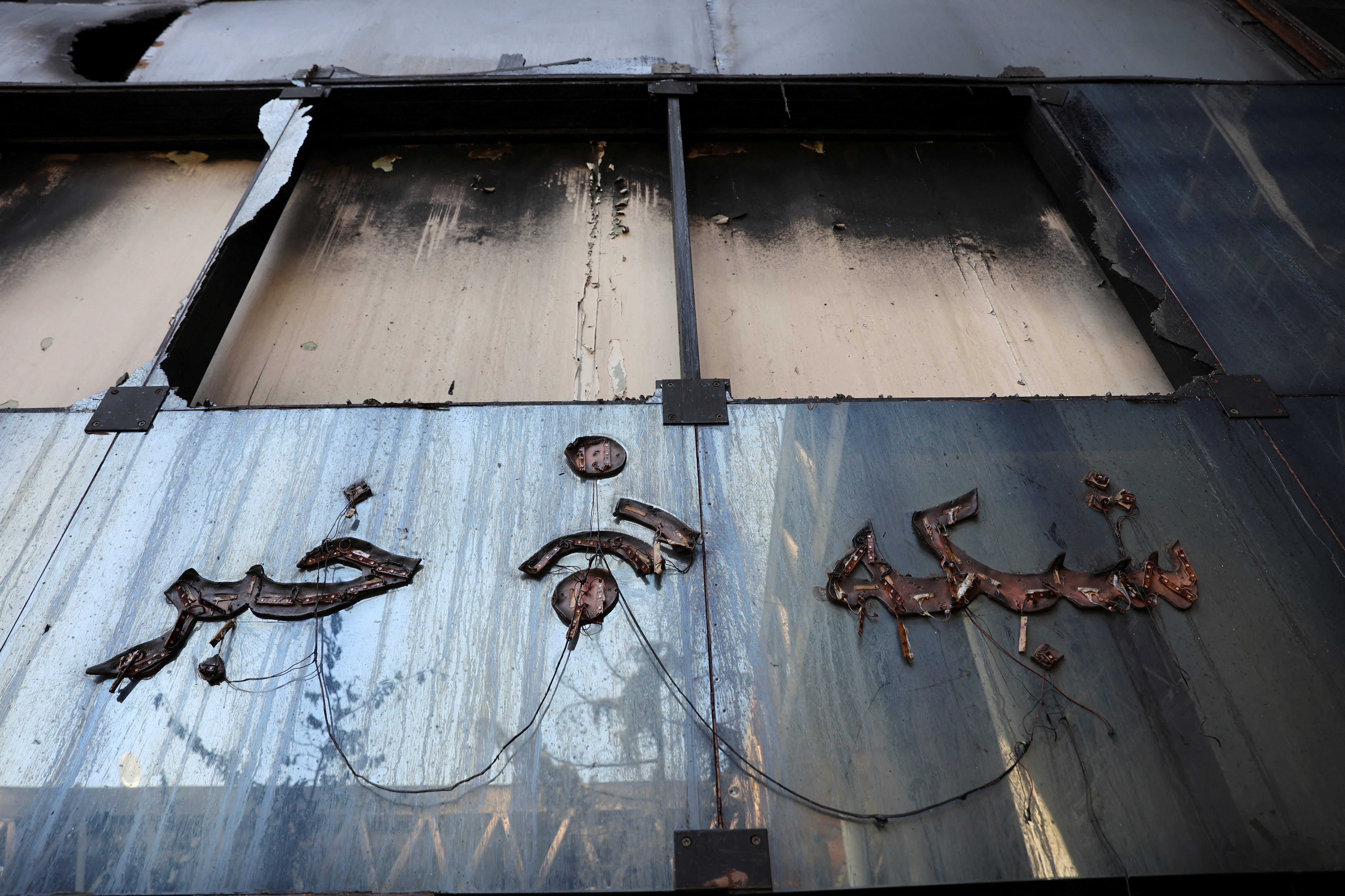 Damage to a building's exterior after an attack.