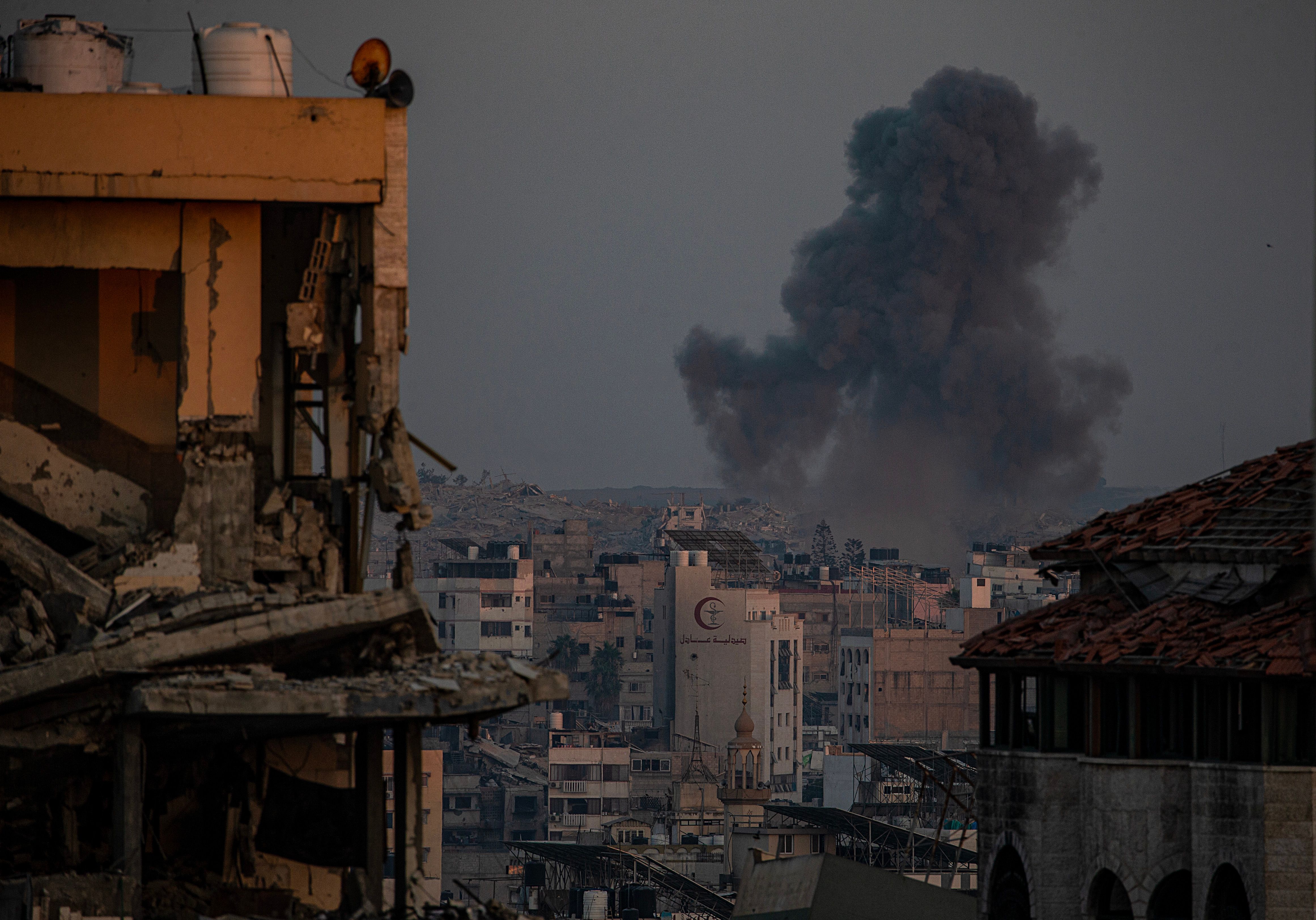 Smoke rises from an Israeli air strike in Al Shejaeiya, East Gaza City.