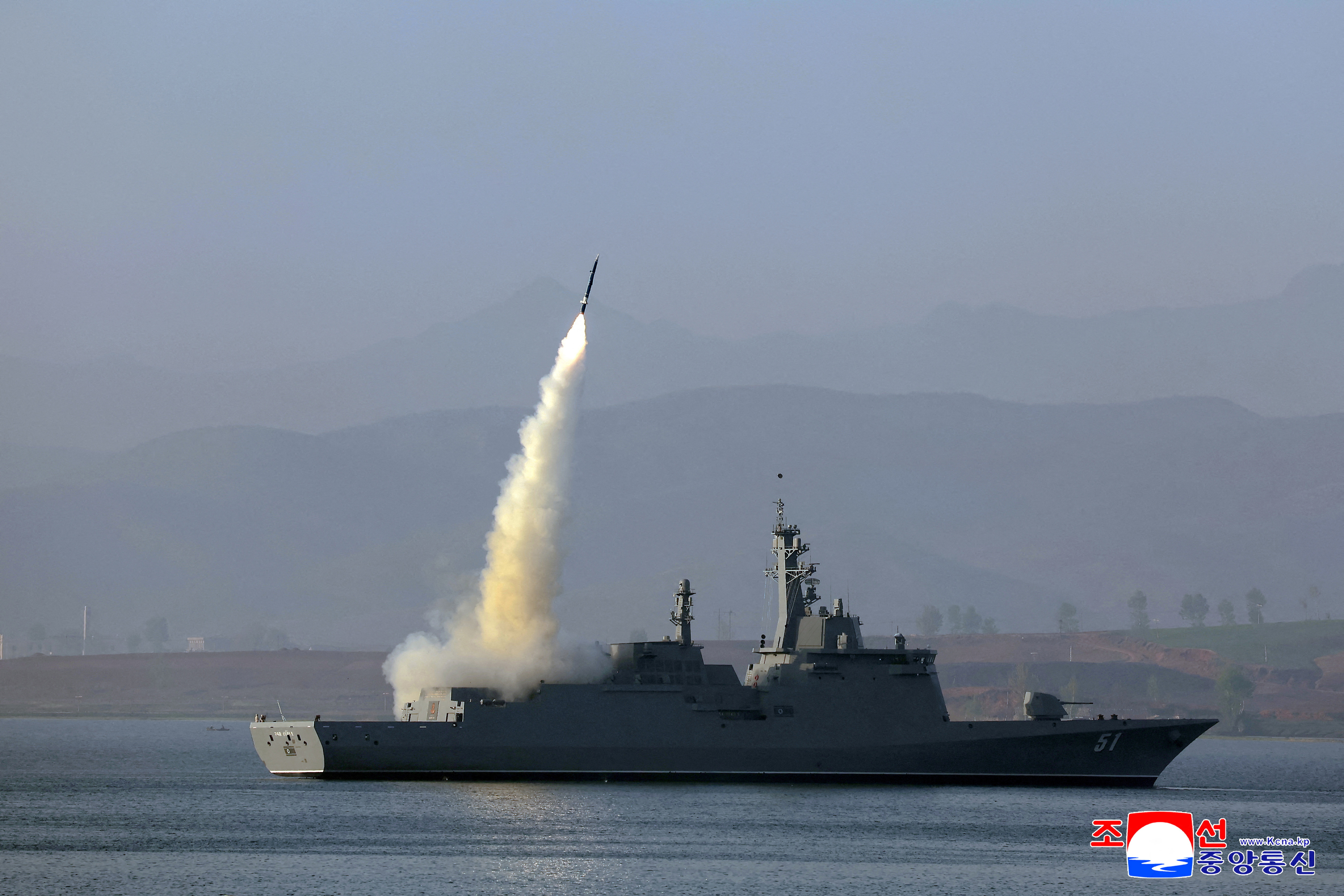 North Korean warship test-firing a missile.