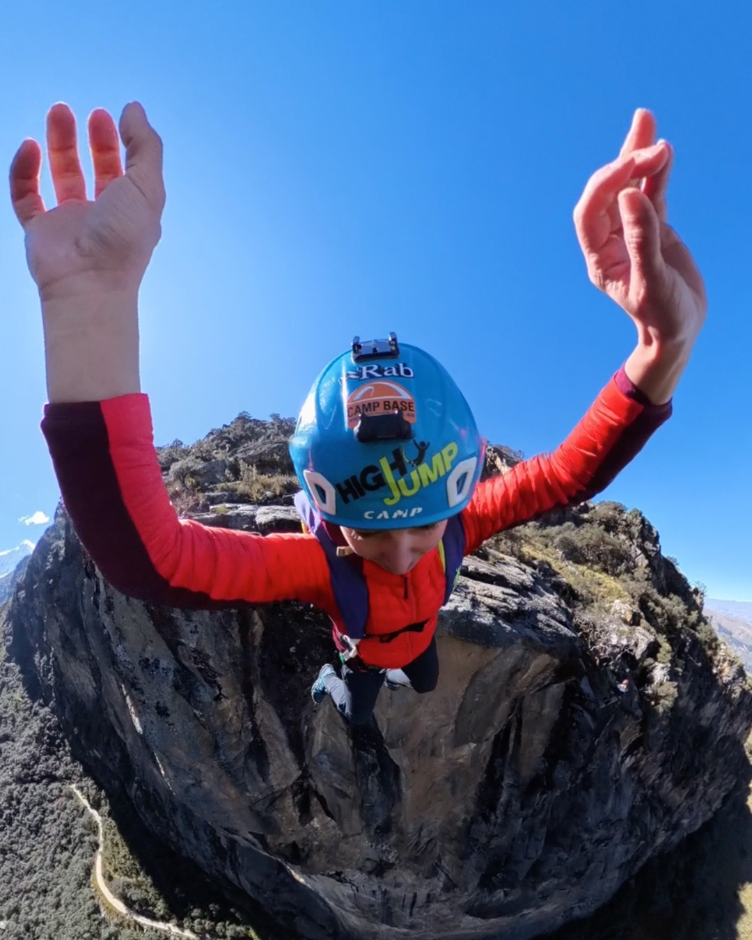 Marta Jiménez BASE jumping from a cliff.