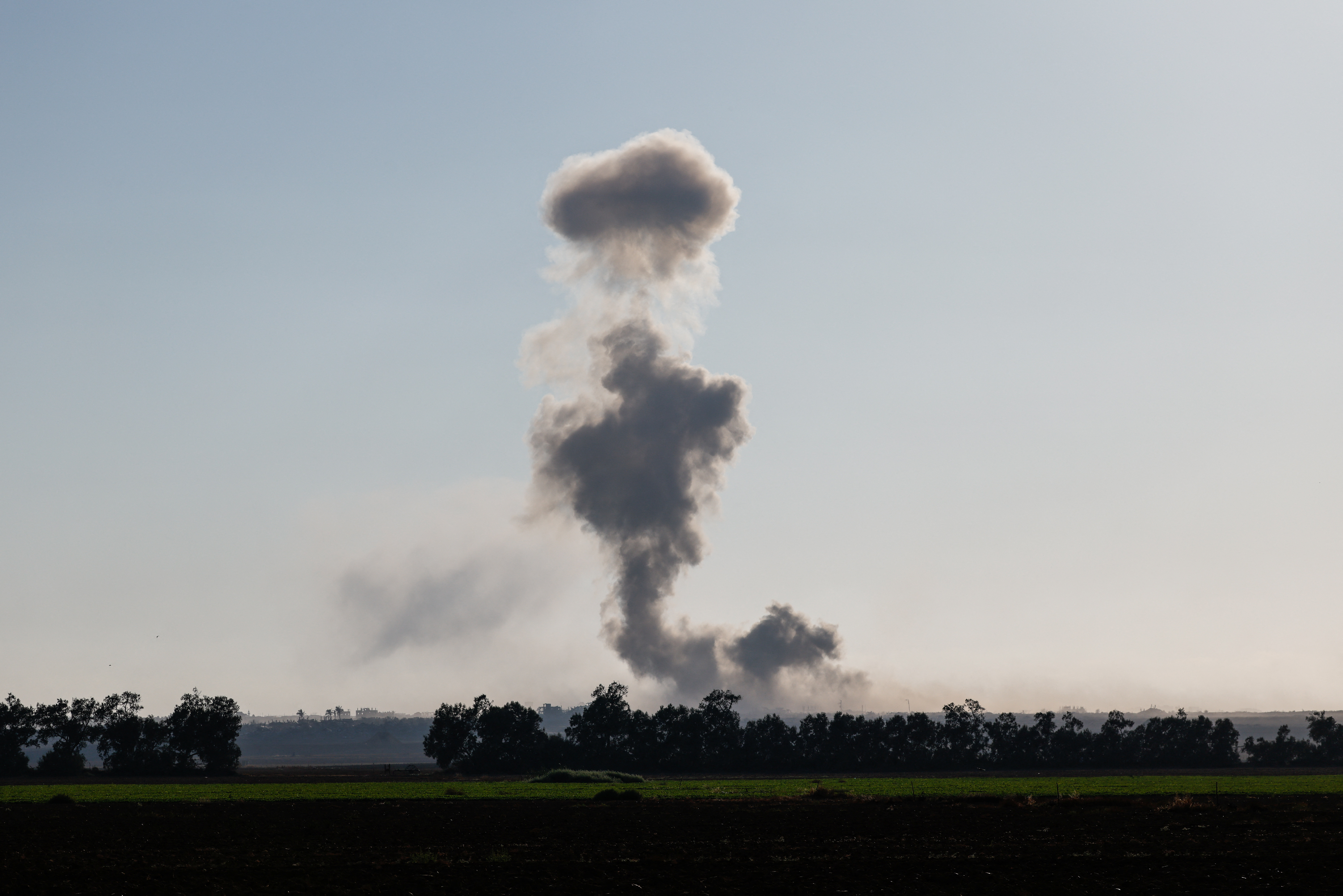 Smoke plume rising from Gaza after an explosion.