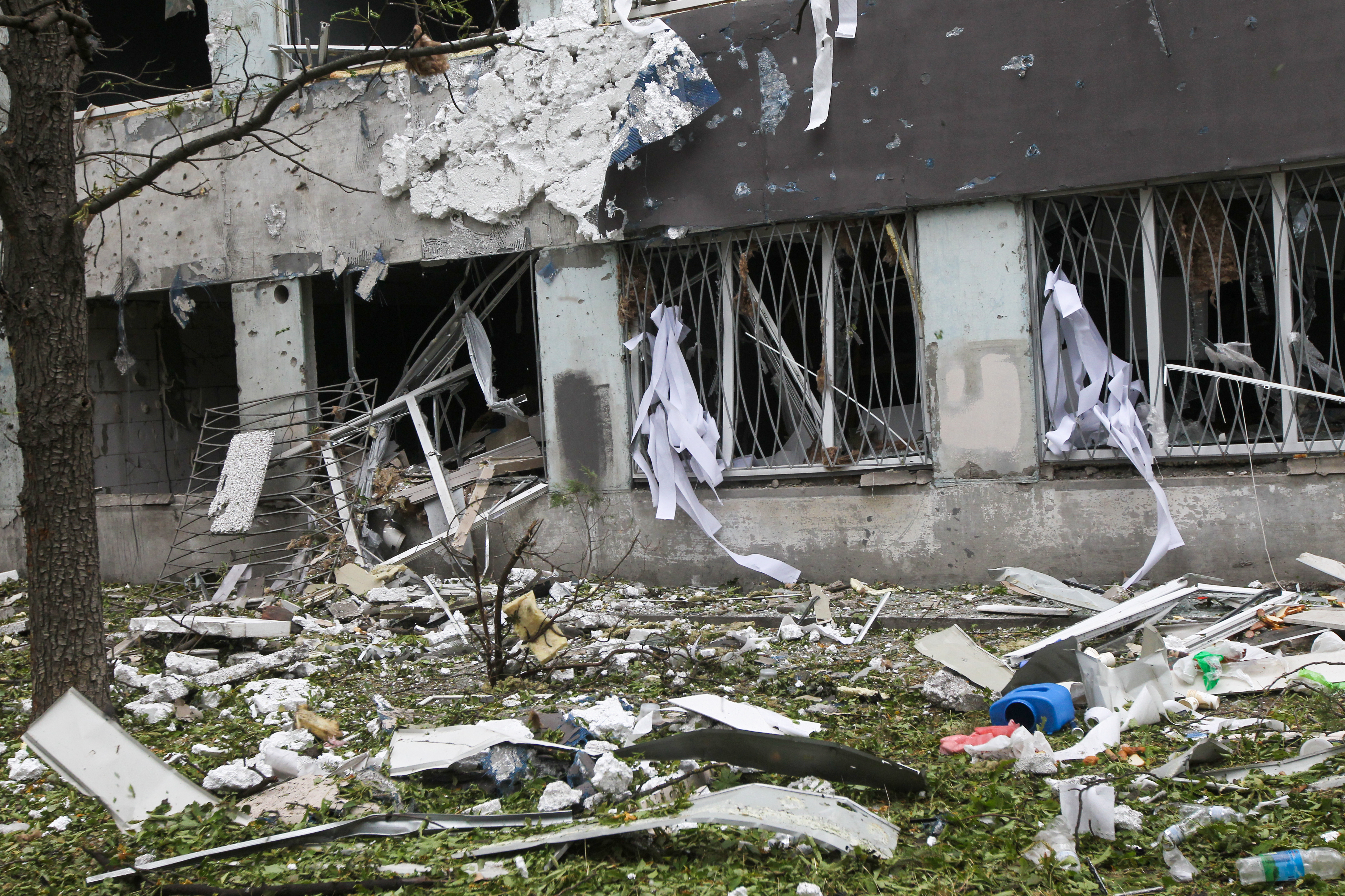 Debris and damaged windows of a building in Dnipro, Ukraine, after a drone attack.